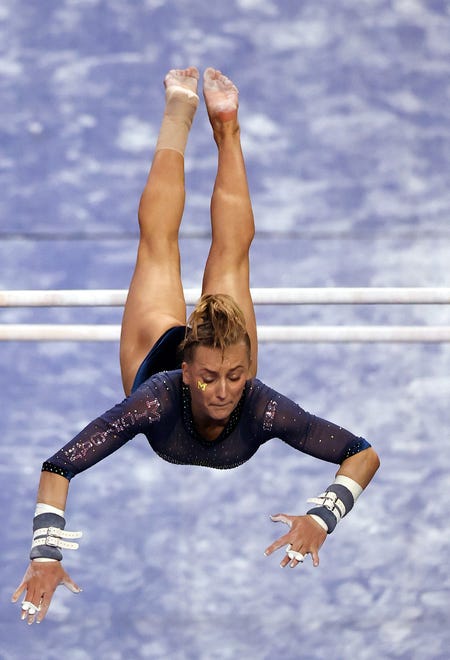 FORT WORTH, TEXAS - APRIL 17:  Abby Brenner of the Michigan Wolverines competes on the uneven parallel bars during the 2021 NCAA Division I Women's Gymnastics Championship.