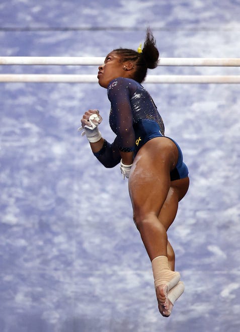 FORT WORTH, TEXAS - APRIL 17:  Sierra Brooks of the Michigan Wolverines competes on the uneven parallel bars during the 2021 NCAA Division I Women's Gymnastics Championship.
