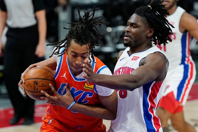 Oklahoma City Thunder center Moses Brown is defended by Detroit Pistons center Isaiah Stewart (28) during the first half.