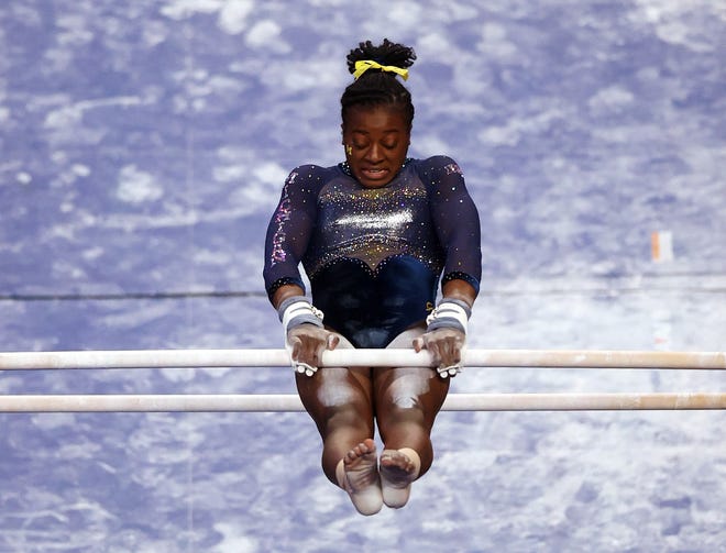 FORT WORTH, TEXAS - APRIL 17:  Gabby Wilson of the Michigan Wolverines competes on the uneven parallel bars during the 2021 NCAA Division I Women's Gymnastics Championship.