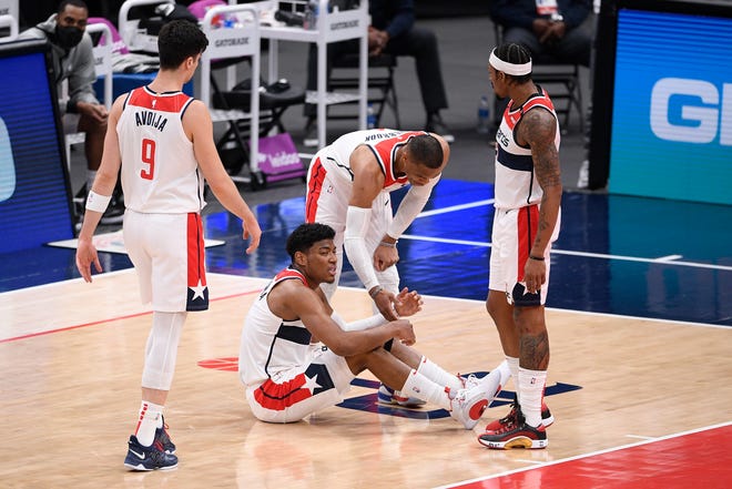 Washington Wizards forward Rui Hachimura (8) reacts after he was injured during the second half.