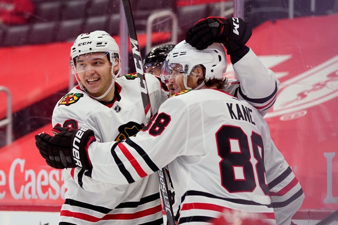 Chicago Blackhawks left wing Philipp Kurashev, left, congratulates right wing Patrick Kane (88) after Kane scored during the first period.