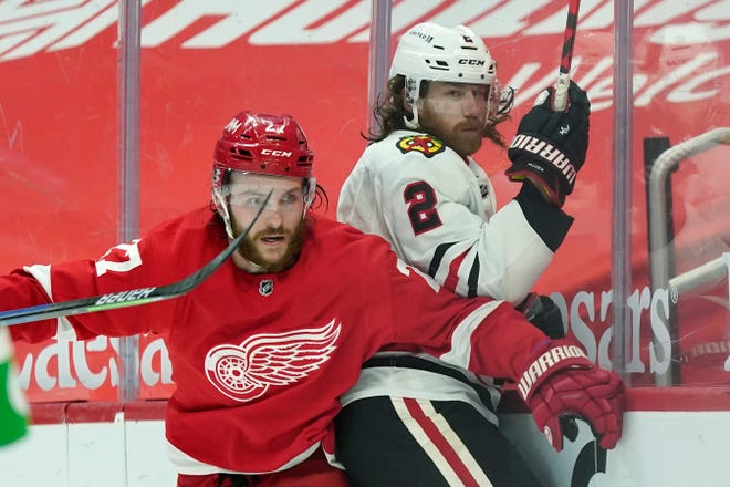 Detroit Red Wings center Michael Rasmussen (27) checks Chicago Blackhawks defenseman Duncan Keith (2) during the second period.