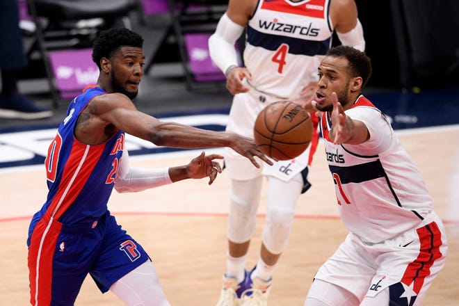 Detroit Pistons guard Josh Jackson, left, passes the ball against Washington Wizards center Daniel Gafford, right, during the second half.