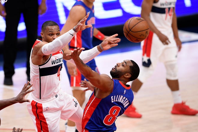 Washington Wizards guard Russell Westbrook (4) passes the ball past Detroit Pistons guard Wayne Ellington (8) during the first half.
