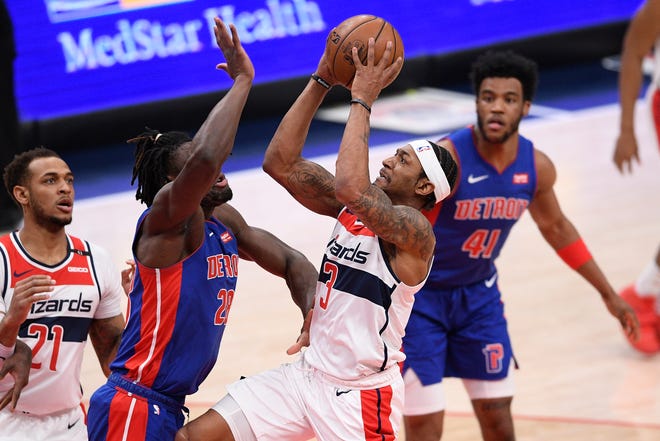 Washington Wizards guard Bradley Beal (3) goes to the basket against Detroit Pistons center Isaiah Stewart (28) during the first half.