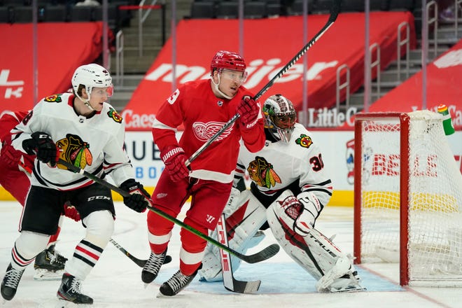 Detroit Red Wings left wing Adam Erne (73) chases the puck during the second period of an NHL hockey game against the Chicago Blackhawks, Saturday, April 17, 2021, in Detroit.