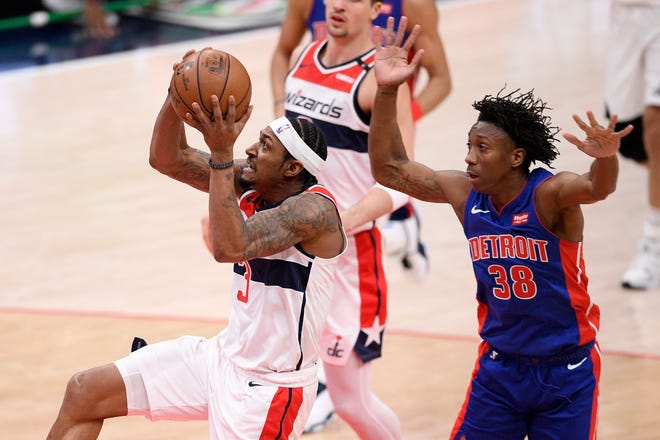 Washington Wizards guard Bradley Beal (3) goes to the basket past Detroit Pistons guard Saben Lee (38) during the first half.