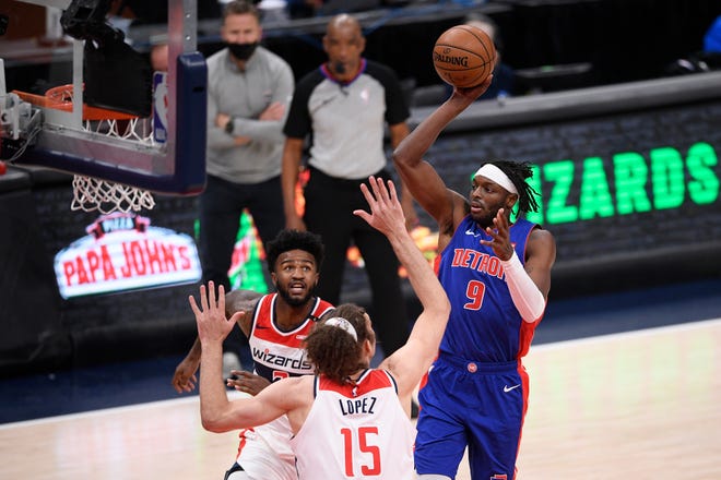 Detroit Pistons forward Jerami Grant (9) shoots against Washington Wizards center Robin Lopez (15) and center Jordan Bell, back left, during the second half.
