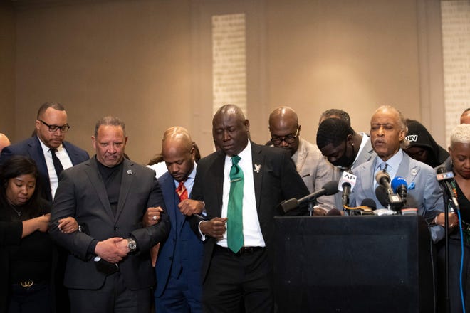 Philonise Floyd (C), Attorney Ben Crump (C-L) and Reverend Al Sharpton (2nd R) pray during a press conference following the verdict in the trial of former police officer Derek Chauvin in Minneapolis, Minnesota on April 20, 2021. - Sacked police officer Derek Chauvin was convicted of murder and manslaughter on april 20 in the death of African-American George Floyd in a case that roiled the United States for almost a year, laying bare deep racial divisions.