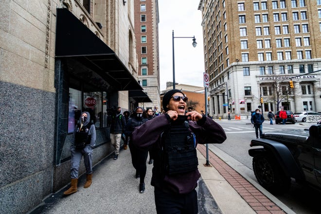 Justice for Black Lives Vice President Danny Santiago leads a march through downtown Grand Rapids on Tuesday, April 20, 2021, in response to the Derek Chauvin trial verdict in the death of George Floyd.