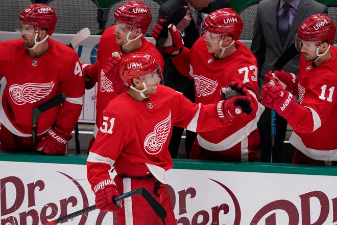 Detroit Red Wings center Valtteri Filppula (51) is congratulated by Darren Helm (43), Richard Panik (24), Adam Erne (73) and Filip Zadina (11) after scoring against the Dallas Stars in the second period of an NHL hockey game in Dallas, Tuesday, April 20, 2021.