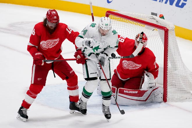 Detroit Red Wings defenseman Marc Staal (18) helps goaltender Thomas Greiss (29) defend against pressure from Dallas Stars center Tanner Kero (64) in the second period of an NHL hockey game in Dallas, Tuesday, April 20, 2021.