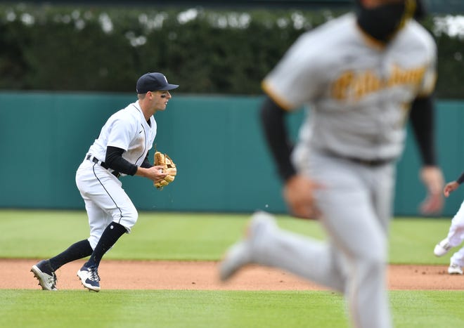 Tigers third baseman Zack Short pops up to make the throw to first base in the fourth inning.