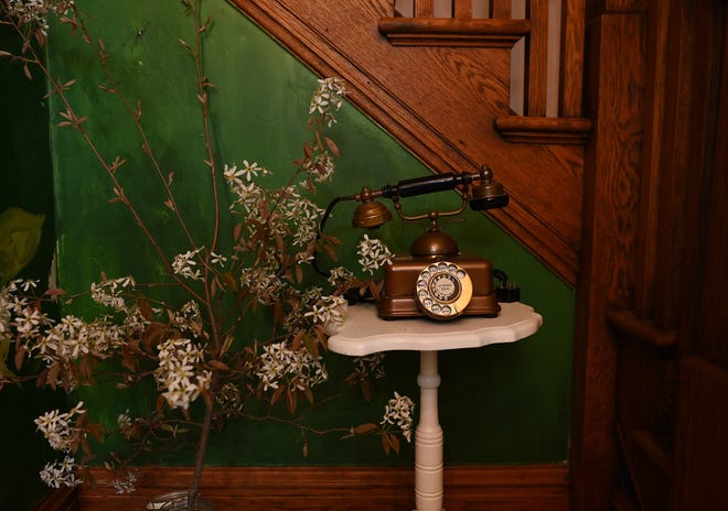 Vintage telephones, found throughout the house, are a nod to the home’s past.