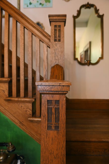 The foyer’s Arts and Crafts oak woodwork is original and dates to 1909.