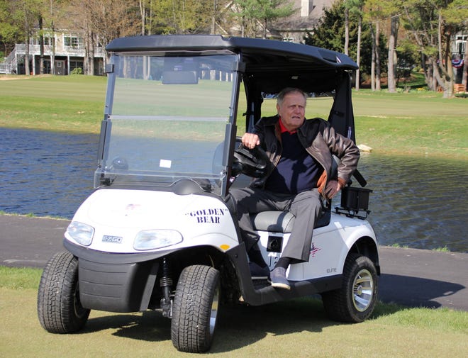 Jack Nicklaus shows up for his ceremonial tee shot in his personalized golf cart.