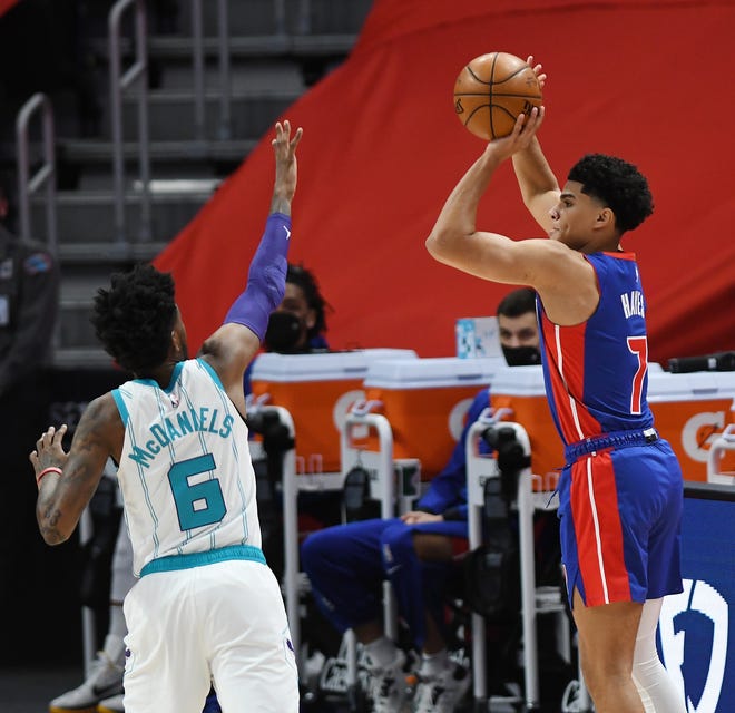 Detroit Pistons' Killian Hayes shoots over Charlotte Hornets' Jalen McDaniels in the first quarter of their game at Little Caesars Arena in Detroit, May 4, 2021.