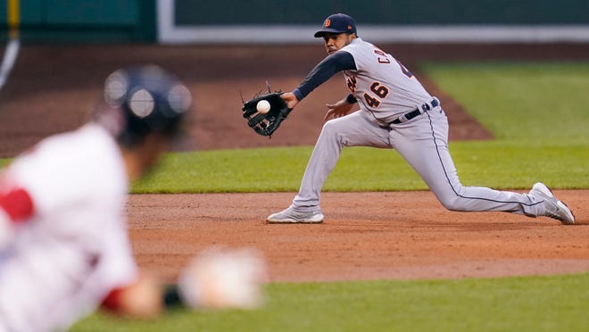 Detroit Tigers third baseman Jeimer Candelario (46) fields a grounder by Boston Red Sox designated hitter J.D. Martinez during the first inning.