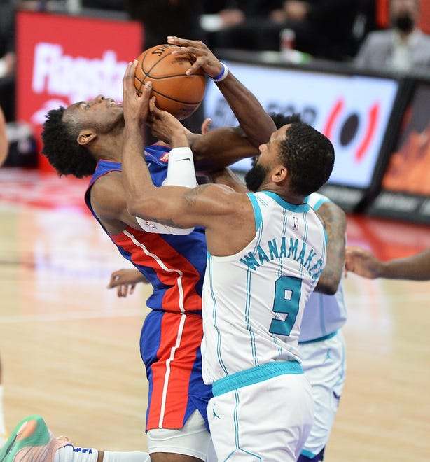Pistons'  Hamidou Diallo is fouled by Hornets' Brad Wannamaker in the fourth quarter.