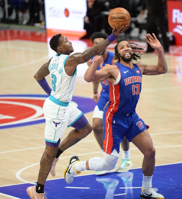 Charlotte Hornets' Terry Rozier shoots over Detroit Pistons' Jahlil Okafor in the second quarter of their game at LCA in Detroit, May 4, 2021.