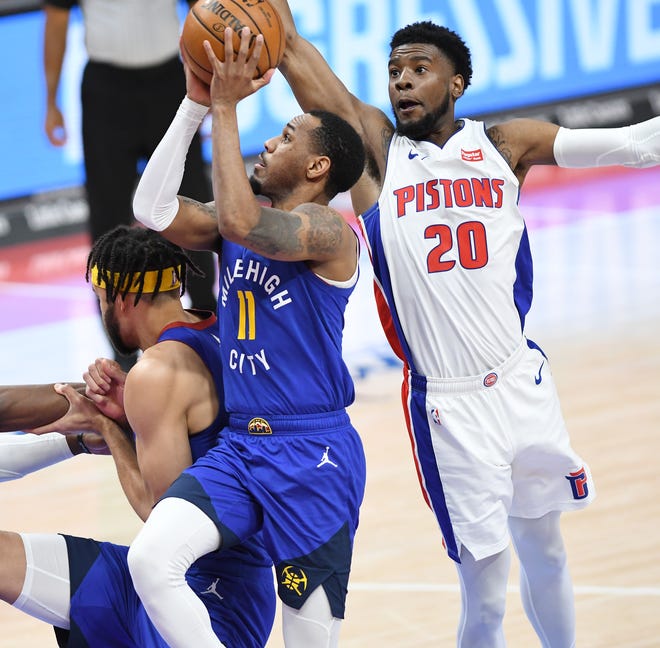 Nuggets' Monte Morris shoots over Pistons' Josh Jackson in the fourth quarter.