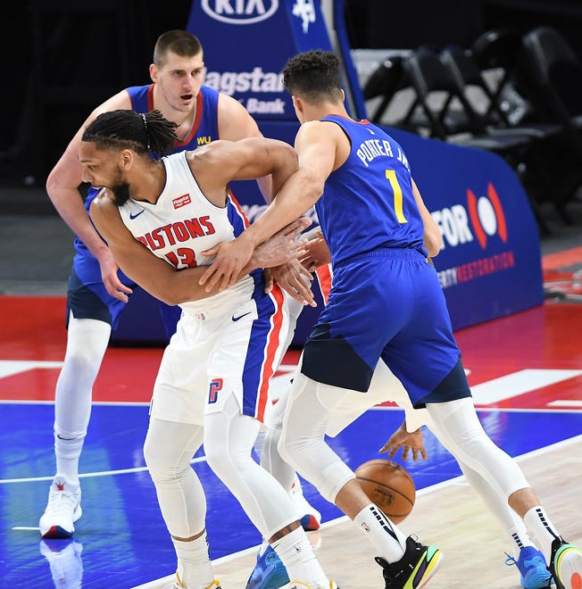 Nuggets' Michael Porter Jr. knocks the ball away from Pistons' Jahlil Okafor in the third quarter.