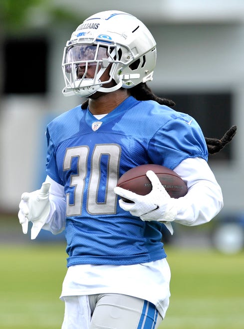 Lions running back Jamaal Williams (30) carries the ball during practice.