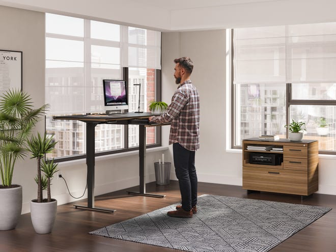 Motorized height-adjustable desks let you sit or stand with the touch of a button. Additional bonus features include USB ports and cord management