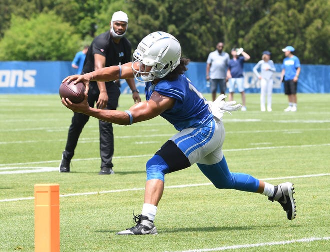 Detroit Lions wide receiver Kalif Raymond reaches for the pylon after a reception during drills.