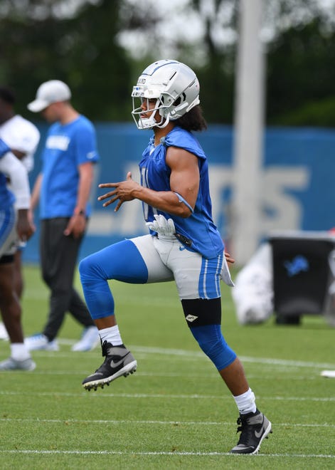 Detroit Lions wide receiver Kalif Raymond stretches out at the start of practice.