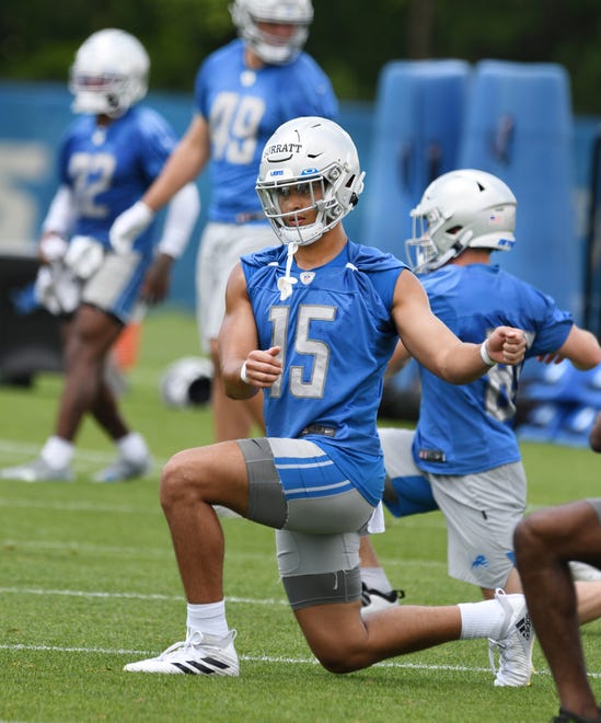 Detroit Lions rookie wide receiver Sage Surratt stretches out at the start of practice.
