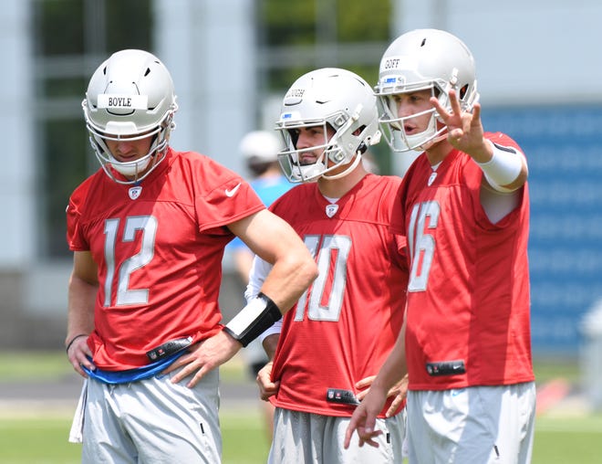 Detroit Lions quarterbacks, from left, Tim Boyle, David Bough and Jared Goff work during a break in the action.
