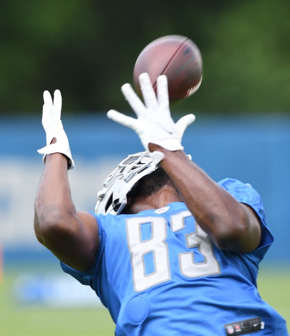 Detroit Lions rookie wide receiver Javon McKinley reaches way back to pull in a reception during drills.