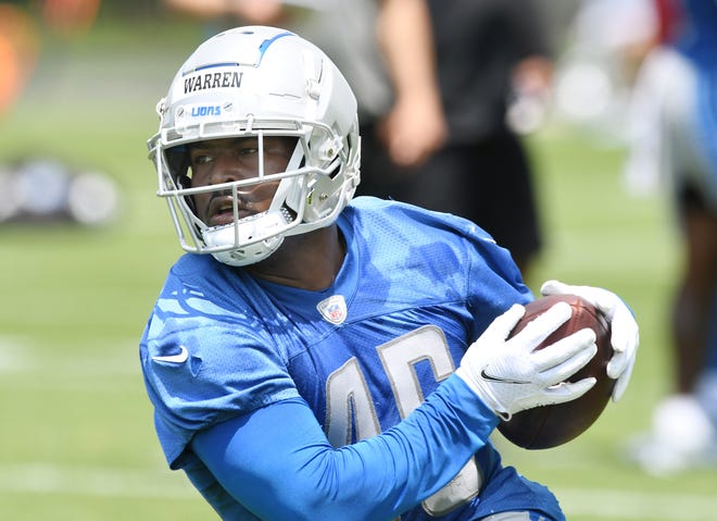 Detroit Lions running back Michael Williams after a reception during drills.