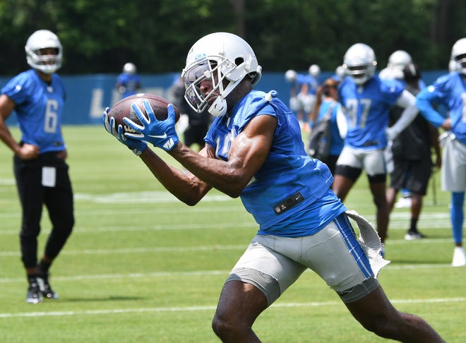 Detroit Lions wide receiver Victor Bolden pulls in a reception during drills.
