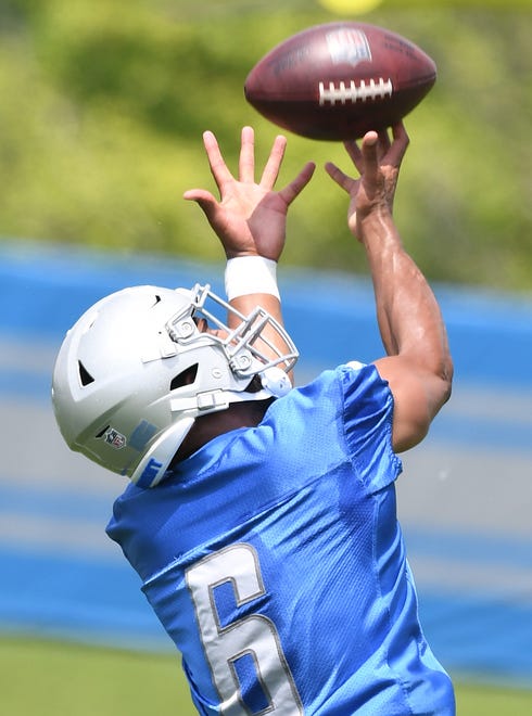 Detroit Lions wide receiver Tyrell Williams readies for a fingertip reception during drills.