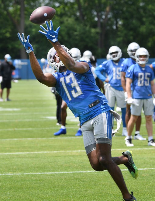 Detroit Lions wide receiver Victor Bolden readies for a reception during drills.