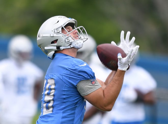 Lions tight end Hunter Thedford pulls in a reception during drills.