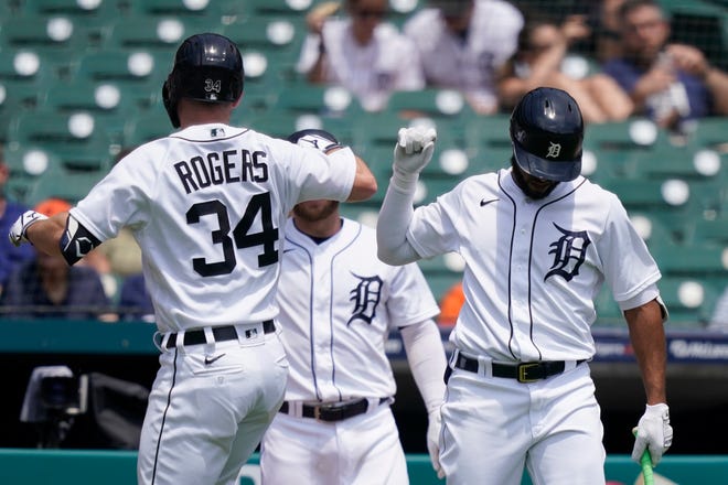 Detroit Tigers' Jake Rogers (34) is greeted by Willi Castro after a solo home run during the second inning.