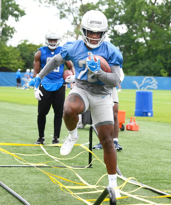 Lions rookie running back Jermar Jefferson works through the ropes during drills.