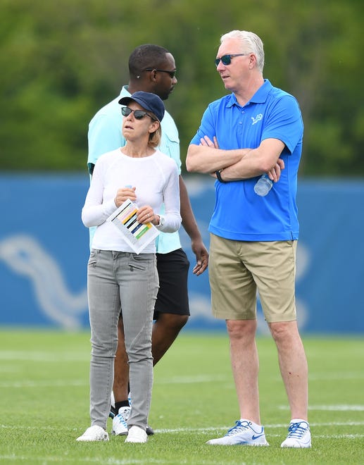 Lions principal owner and chairman Sheila Ford Hamp and Lions president and CEO Rod Wood watch over practice in Allen Park.