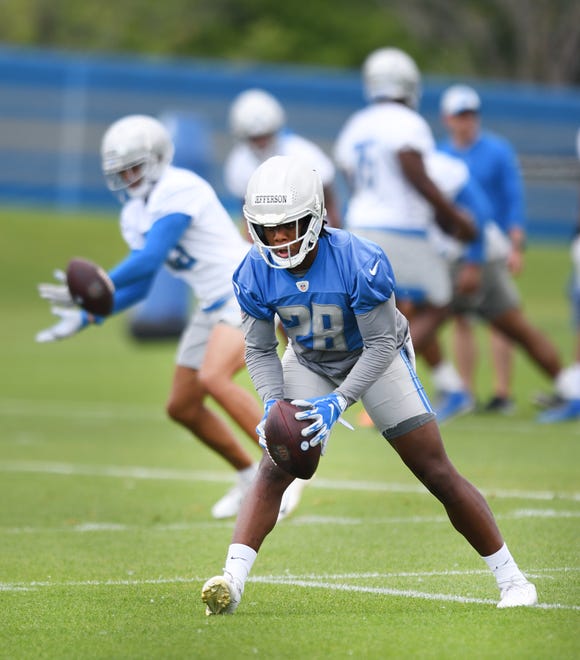 Lions rookie running back Jermar Jefferson pulls in a reception during drills.