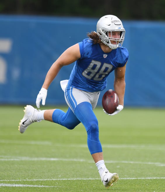 Lions tight end T.J. Hockenson works through a drill at practice.