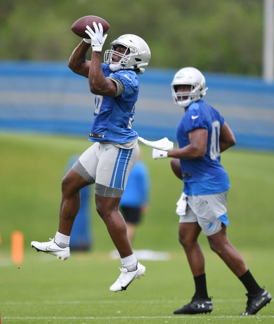 Lions rookie running back Dedrick Mills pulls in a reception during drills.