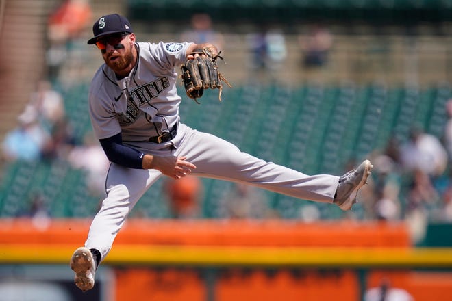 Seattle Mariners second baseman Donovan Walton catches the relay throw from left fielder Jake Fraley but is unable to tag Detroit Tigers' Jake Rogers during the fourth inning.