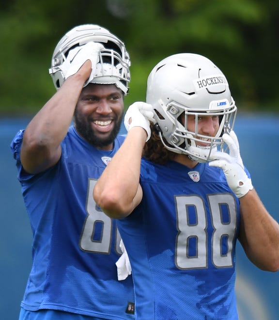 Lions tight ends Darren Fells and T.J. Hockenson head to the next drill.
