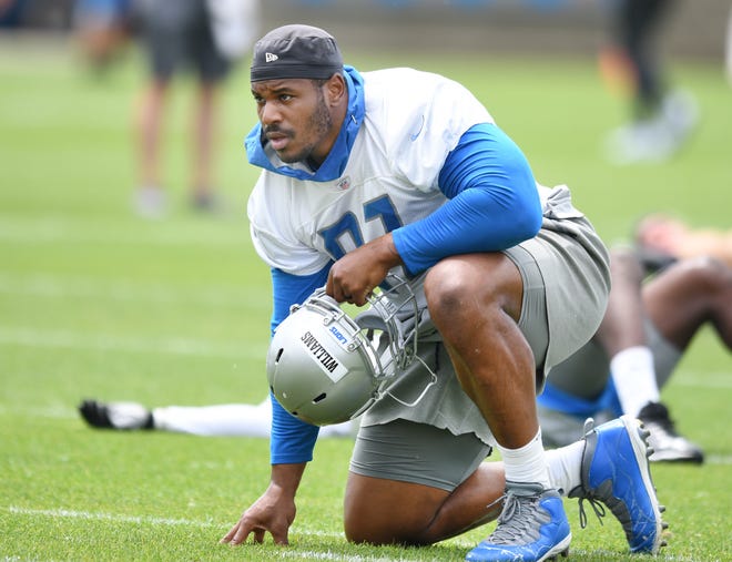 Lions defensive lineman Nick Williams breaks from stretching and heads to the first drill.