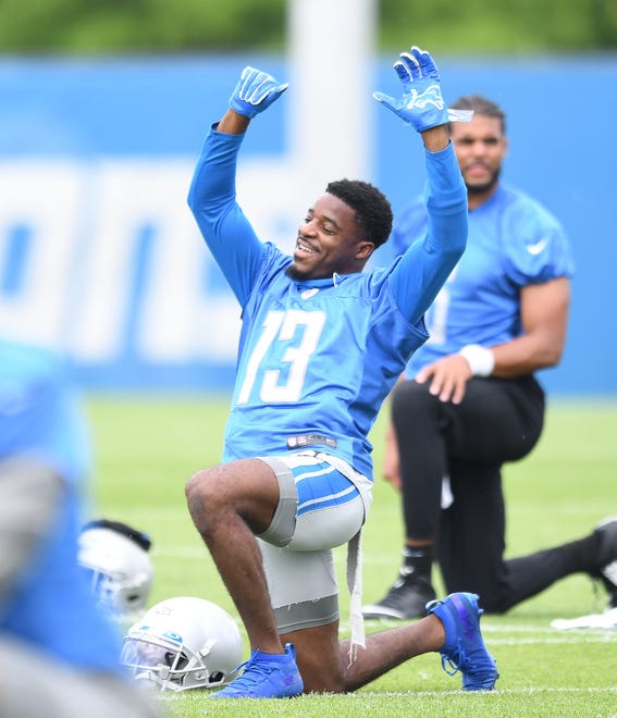 Lions wide receiver Victor Bolden stretches out at the last day of minicamp in Allen Park.