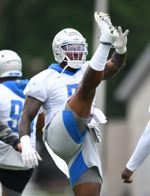 Lions defensive lineman Michael Brockers stretches out during warmups.
